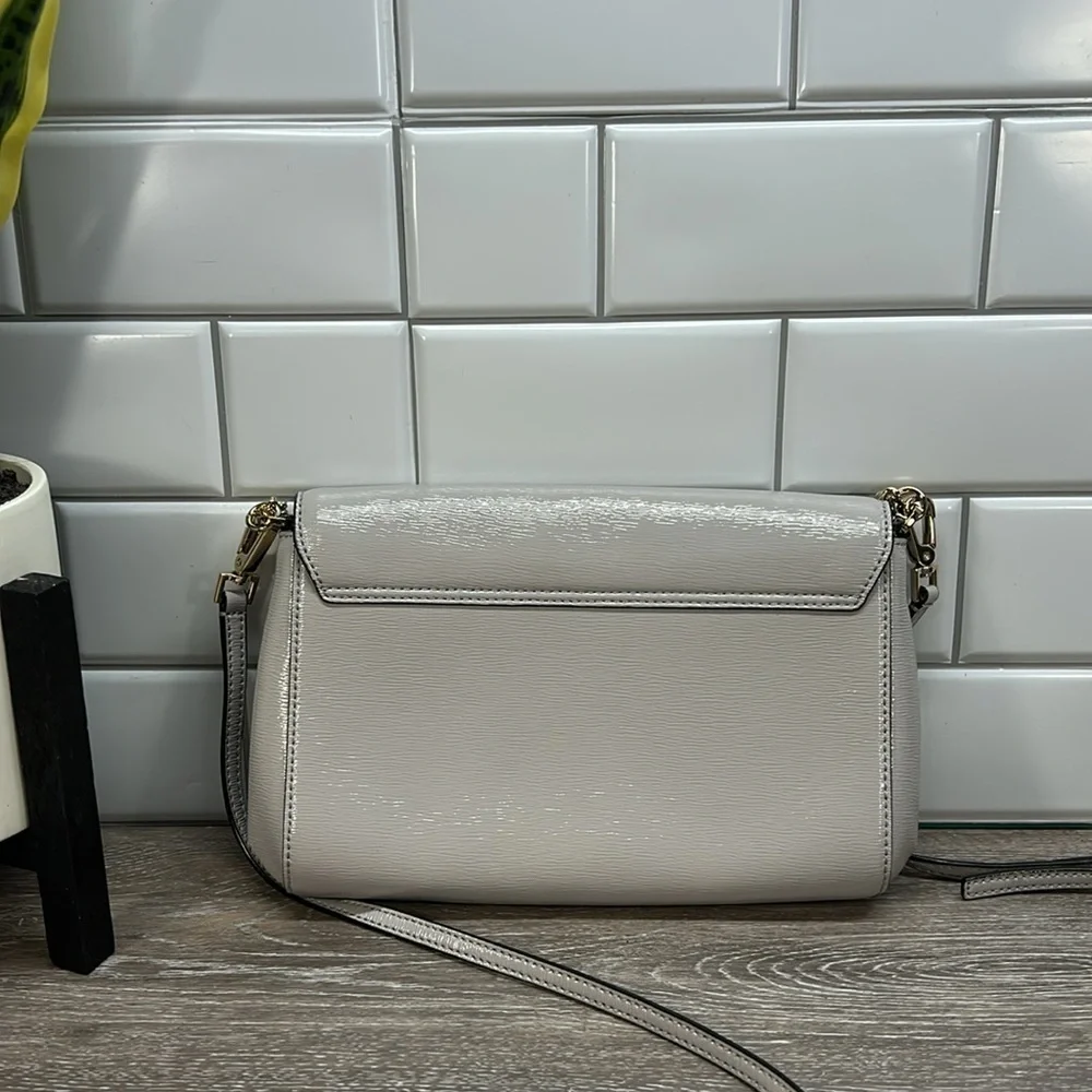 Kate Spade gray crossbody with gold chain